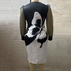 Wąska sukienka z długimi rękawami i siatkowym nadrukiem