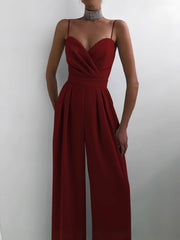 Modny damski kombinezon w jednolitym kolorze z szerokimi nogawkami i szeroką talią, bez rękawów i szelkami