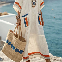 Elegancka długa sukienka z kieszeniami