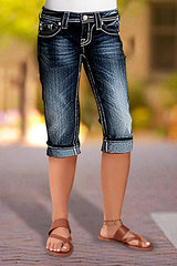 Jeansy Capri ze średnim stanem i kieszeniami, z rolowanym dołem