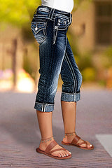 Jeansy Capri ze średnim stanem i kieszeniami, z rolowanym dołem