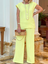 Damski jednokolorowy top bez rękawów z okrągłym dekoltem i zestaw spodni z prostymi nogawkami z kieszeniami