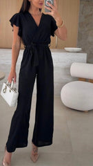 Letni dopasowany kombinezon z szerokimi nogawkami i dekoltem w serek