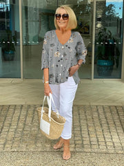 Elegancka koszula z kwiatowym wzorem i guzikami