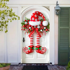 Świąteczny baner z nogami elfa na drzwiach