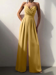 Modny damski kombinezon w jednolitym kolorze z szerokimi nogawkami i szeroką talią, bez rękawów i szelkami