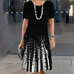 Sukienka plisowana z nadrukiem