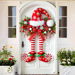 Świąteczny baner z nogami elfa na drzwiach