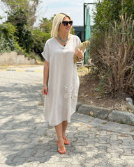 Solidna lniana sukienka maxi z dekoltem w serek i haftowanym dołem