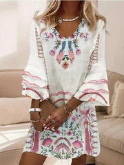 Sukienka z dekoltem w serek i rękawami typu trąbka w świeżym print