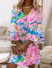 Sukienka z dekoltem w serek i rękawami typu trąbka w świeżym print