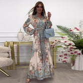 Elegancka sukienka z dekoltem w serek, wysokim stanem, kwiatowym nadrukiem i guzikami