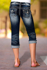 Jeansy Capri ze średnim stanem i kieszeniami, z rolowanym dołem