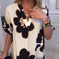 Damska luźna sukienka z głębokim dekoltem w szpic z nadrukiem