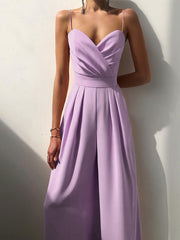 Modny damski kombinezon w jednolitym kolorze z szerokimi nogawkami i szeroką talią, bez rękawów i szelkami