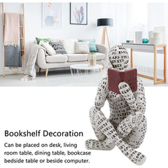 Nordycka współczesna statua czytającej kobiety