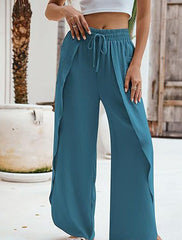 Damskie spodnie z kieszeniami i szeroką nogawką z elastyczną talią